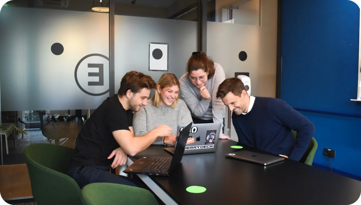Team working on laptops